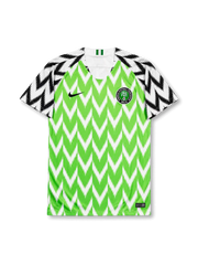 front view of Nigeria 2018 World Cup home shirt with green zigzag pattern, black and white graphic sleeves, Nigeria crest, and V-neck collar