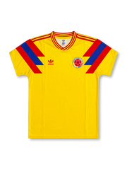front view of Colombia 1990 World Cup home shirt with yellow body, red and blue shoulder graphics, adidas trefoil logo, and Colombia crest