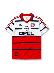 Bayern Munich 1998-2000 away jersey, front view, white upper body and red lower body with navy horizontal stripes, red V-neck collar, black adidas logo, FC Bayern Munchen crest, navy Opel sponsor logo, small tag near bottom hem