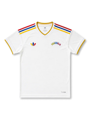 Venezuela 2026/27 away shirt with a white body, yellow-trim V-neck, red-blue-yellow shoulder stripes, heritage-style Trefoil chest branding, arched Venezuela wordmark, and La Vinotinto back-neck text.