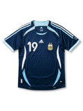 Front view of Argentina 2006 World Cup away shirt in dark navy with light blue trim, AFA crest, adidas logo, and number 19 on the front.