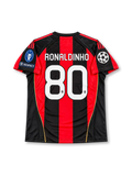 AC Milan 2010/11 UEFA Champions League Home Jersey Ronaldinho #80, classic adidas soccer shirt featuring red and black vertical stripes, AC Milan club crest, Fly Emirates sponsor logo, and Ronaldinho name and number 80 on the back.