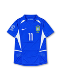 Front view of Brazil 2002 World Cup away shirt with blue body, white side panels, Brazil crest, #11 chest number, and Korea/Japan 2002 sleeve detail.