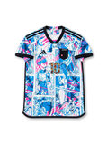 Front view of Japan Dragon Ball Super collaboration shirt with all-over manga panel graphics, Japan chest patch, central #10 detail, and black trim.