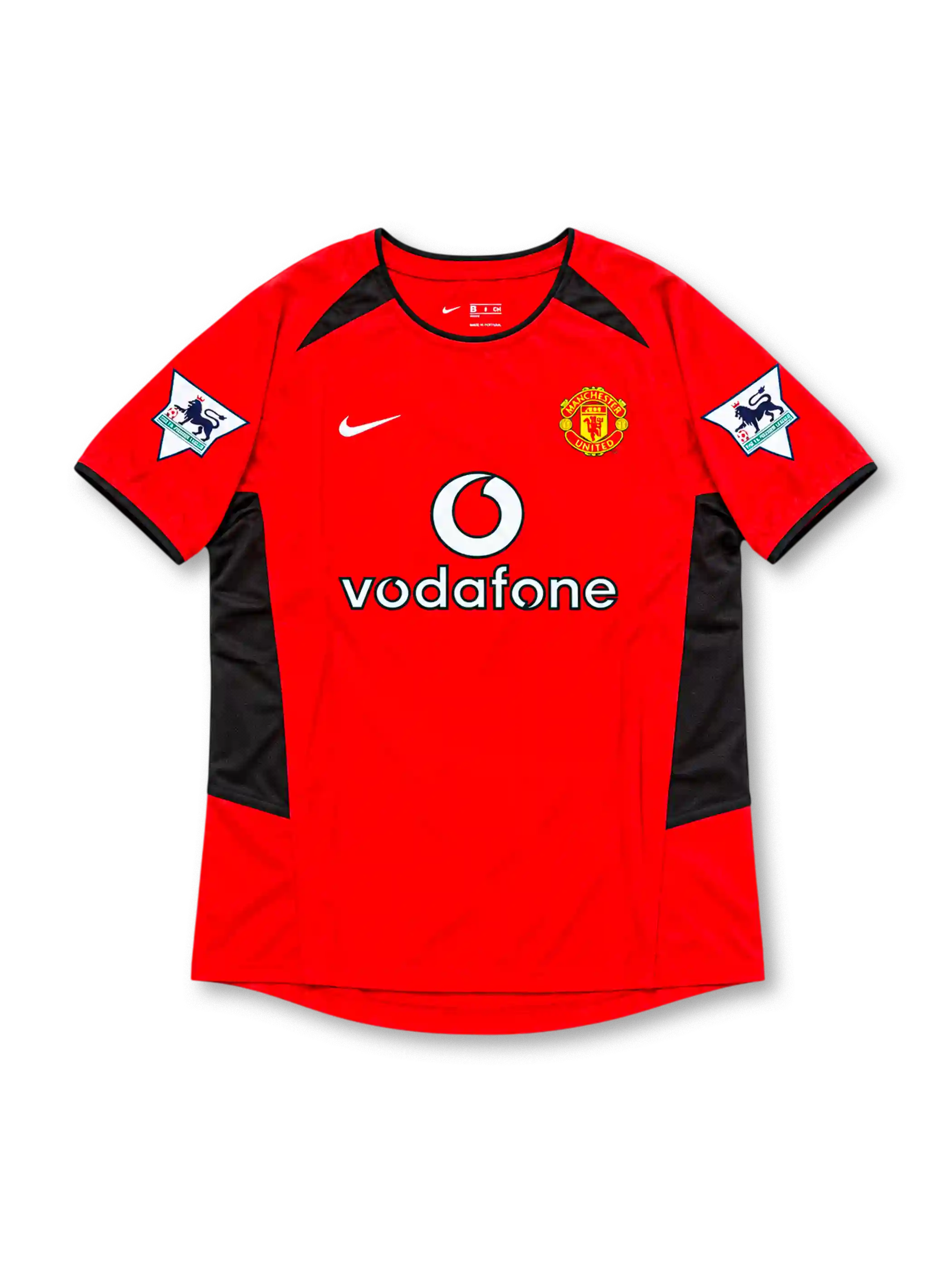 Manchester United 2002-04 home jersey by Nike, featuring a classic red soccer shirt with a black crew neck collar, black sleeve trim, angular black shoulder and side panels, white Nike Swoosh, Vodafone sponsor logo, and Manchester United club crest, representing the 2002-03 and 2003-04 seasons.