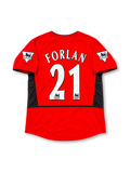 Manchester United 2002-04 home jersey by Nike, featuring a classic red soccer shirt with a black crew neck collar, black sleeve trim, angular black shoulder and side panels, white Nike Swoosh, Vodafone sponsor logo, and Manchester United club crest, representing the 2002-03 and 2003-04 seasons.