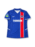 Paris Saint-Germain 2002-03 home jersey featuring Ronaldinho #10, Nike navy blue soccer shirt with an offset red vertical stripe bordered by thin white lines, white-trimmed V-neck collar, white Nike Swoosh, THOMSON sponsor logo, PSG club crest, LFP sleeve patch, and RONALDINHO name with number 10 on the back.