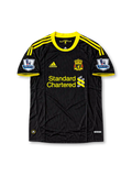 Front view of the 2010/11 Liverpool black and yellow third soccer jersey by adidas, featuring yellow three-stripe shoulder detailing, the Liverpool crest, Standard Chartered sponsor, and Barclays Premier League sleeve patches.