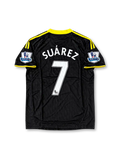 Front view of the 2010/11 Liverpool black and yellow third soccer jersey by adidas, featuring yellow three-stripe shoulder detailing, the Liverpool crest, Standard Chartered sponsor, and Barclays Premier League sleeve patches.