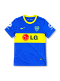 Boca Juniors 2010-11 home soccer jersey featuring Juan Román Riquelme #10, royal blue fabric, a wide yellow chest band, yellow Nike Swoosh, CABJ crest, LG sponsor, and Total sleeve branding.