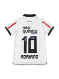 Front view of the Corinthians 2011-12 white home football jersey associated with Adriano #10, featuring a black polo collar and sleeve trim, Nike swoosh, Corinthians crest, Neo Química Genéricos chest sponsor, and red Bozzano sleeve branding.