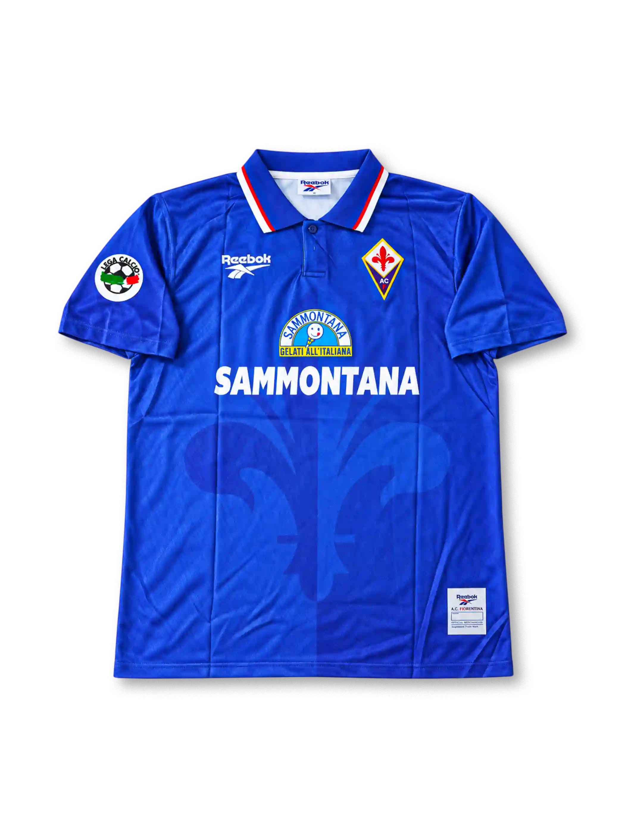 Front view of a royal blue Fiorentina Reebok football shirt associated with Gabriel Batistuta #9, featuring a red and white trimmed polo collar, Fiorentina crest, Reebok logo, Sammontana chest sponsor, and Serie A sleeve patch.