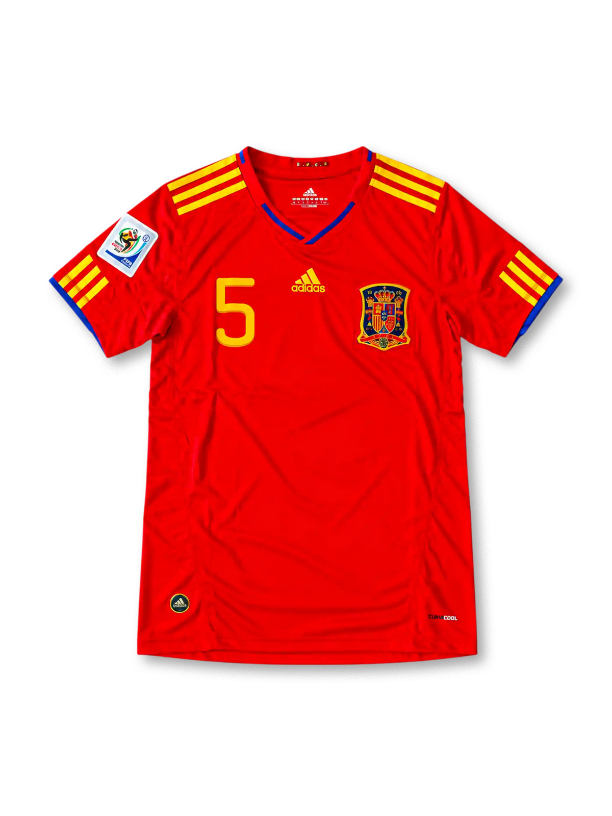 Front view of the Spain 2010 red home football jersey featuring Carles Puyol number 5, yellow Adidas shoulder stripes, blue neckline detailing and the Spanish national team crest.