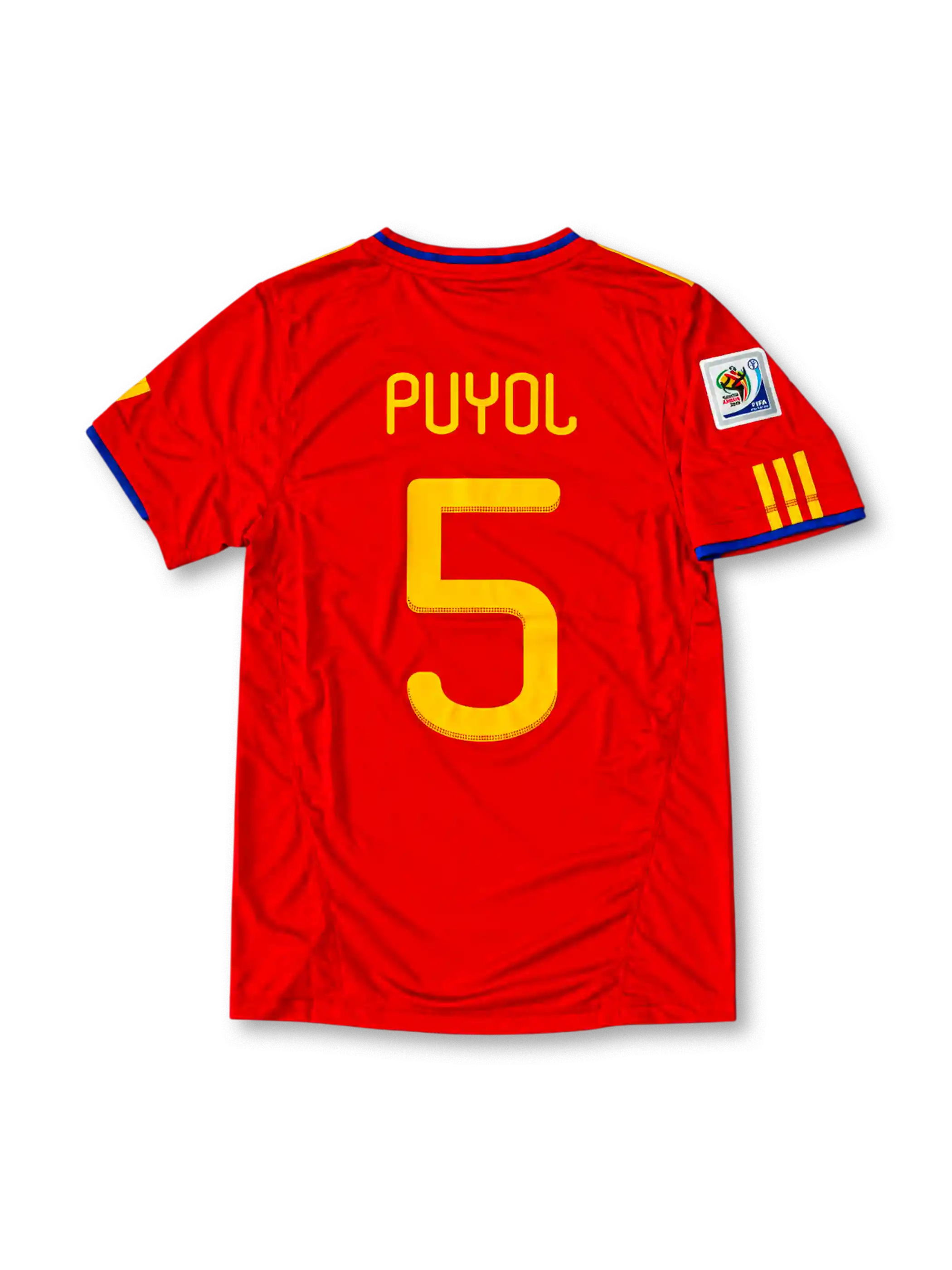 Front view of the Spain 2010 red home football jersey featuring Carles Puyol number 5, yellow Adidas shoulder stripes, blue neckline detailing and the Spanish national team crest.