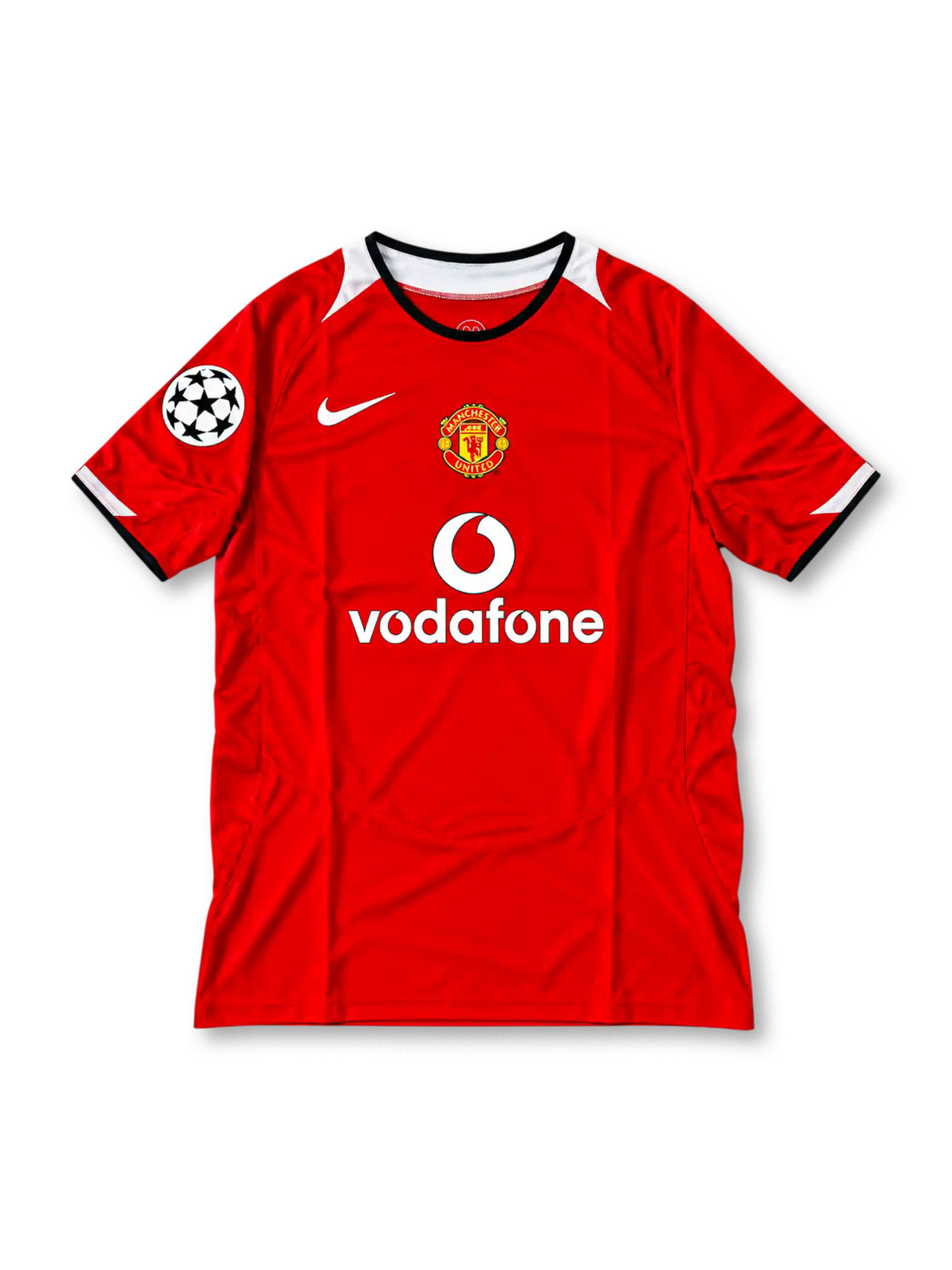 Manchester United 2004-06 red Nike Total 90 home jersey featuring white shoulder panels, black collar trim, club crest, Vodafone sponsor and Champions League starball sleeve patch.
