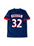 Paris Saint-Germain 2013-14 navy Nike home jersey featuring a white upper-chest panel, red central stripe, red sleeve cuffs, PSG crest and Fly Emirates sponsor.