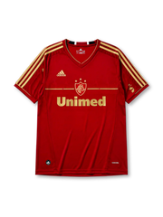 Fluminense 2012 third jersey in deep red with gold adidas stripes and Unimed sponsor branding