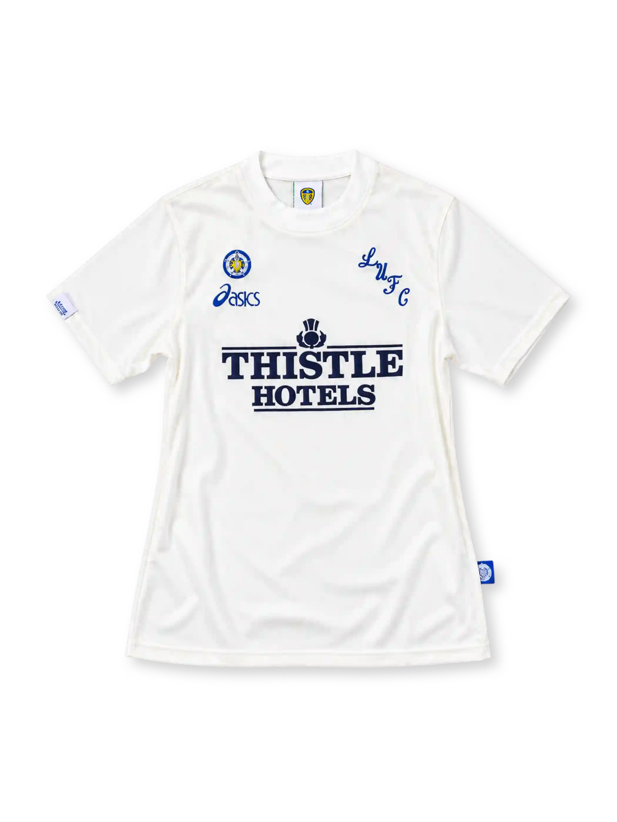 Leeds United 1995/96 white home jersey featuring blue ASICS branding, LUFC chest lettering, and navy Thistle Hotels sponsor, front view.