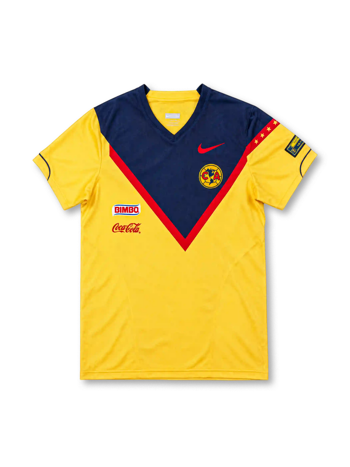 Club América 2006 yellow home jersey featuring a navy-and-red chest chevron, red Nike Swoosh, club crest, Bimbo and Coca-Cola logos, front view.
