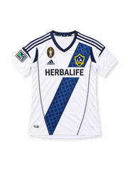 LA Galaxy 2012 white home jersey featuring a patterned navy diagonal sash, adidas logo, Herbalife sponsor, club crest, and MLS champions emblem, front view.