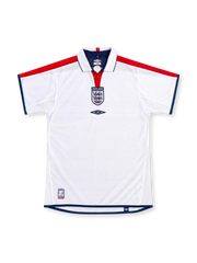 England 2004 white home jersey by Umbro with red shoulder panels, navy trim, white polo collar, central Three Lions crest and Umbro logo.