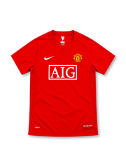 Manchester United 2007/08 red Nike home jersey with white AIG sponsor, club crest, Nike Swoosh and The Red Devils hem patch.
