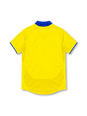 Arsenal 2003/04 yellow away jersey with royal-blue polo collar, blue Nike Swoosh, club crest, navy O2 sponsor and blue sleeve trim.