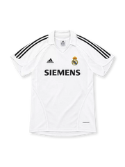 Real Madrid 2005/06 white home jersey with black adidas shoulder stripes, white polo collar, club crest, Siemens sponsor and FORMOTION branding.
