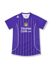 Manchester City 2007/08 purple away jersey with white vertical pinstripes, Le Coq Sportif logo, three-star club crest, and Thomas Cook.com sponsor.