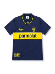 Boca Juniors 1993/95 navy-blue home jersey with yellow horizontal chest band, Parmalat sponsor, Olan logo, yellow-trimmed polo collar and CABJ crest.