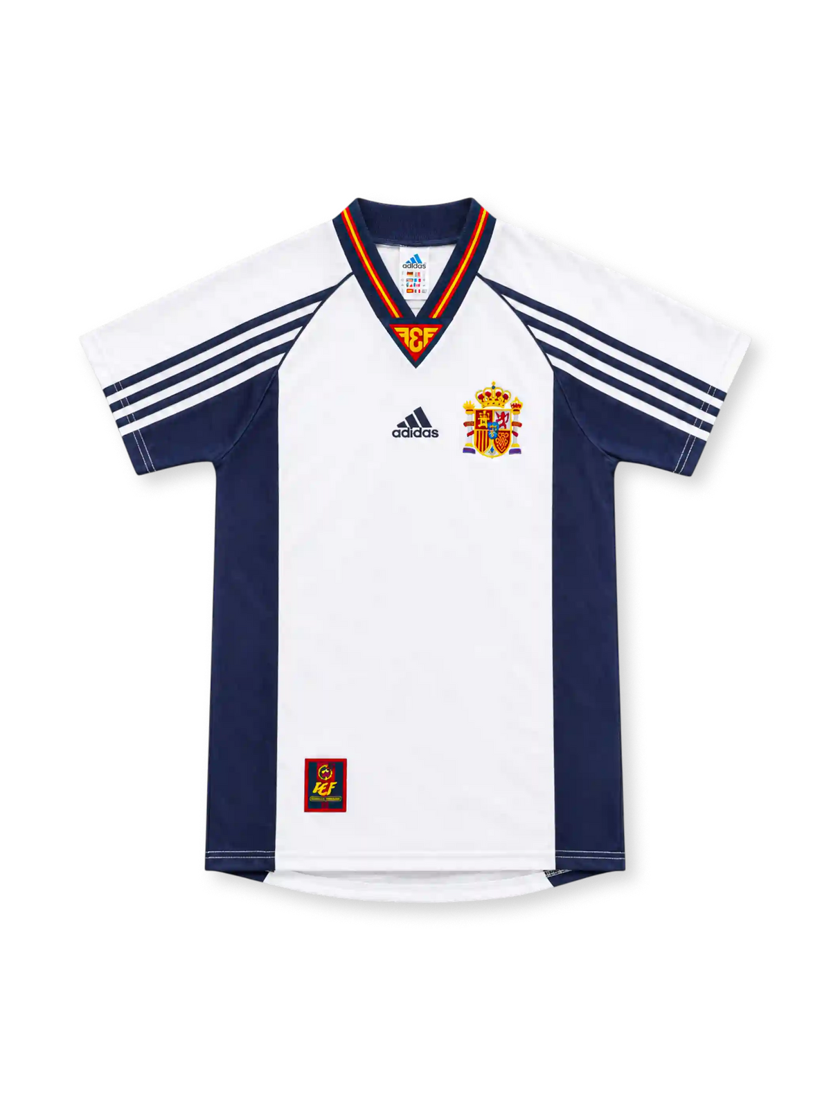 Spain 1998 white away jersey with navy side panels, adidas three-stripe sleeves, red-and-yellow V-neck trim, Spanish federation crest and lower-hem emblem.