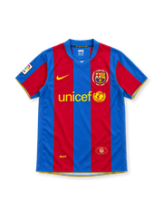 Barcelona 2007/08 home jersey with red-and-blue vertical stripes, yellow Nike Swoosh, UNICEF sponsor, Camp Nou 1957–2007 anniversary crest and La Liga sleeve patch.