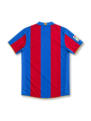 Barcelona 2007/08 home jersey with red-and-blue vertical stripes, yellow Nike Swoosh, UNICEF sponsor, Camp Nou 1957–2007 anniversary crest and La Liga sleeve patch.