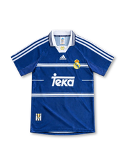 Real Madrid 1998/99 blue away jersey with white horizontal chest stripes, adidas three-stripe shoulders, white polo collar, club crest and Teka sponsor.