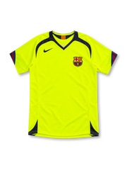 Barcelona 2005/06 neon yellow away jersey by Nike with navy V-neck and shoulder panels, red-and-blue sleeve trim, navy Swoosh, FCB crest and sponsor-free front.