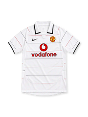Manchester United white retro jersey with fine red-and-black horizontal pinstripes, white polo collar with black edging, black Nike Swoosh, club crest and red Vodafone sponsor.