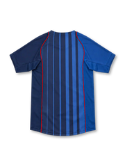 Barcelona 2004/05 Nike away jersey with royal-blue and navy vertical stripes, red piping along the front, contrasting blue sleeves, yellow Nike Swoosh, Barcelona crest, and rounded neckline.