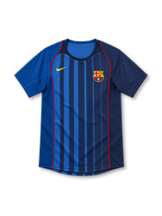 Barcelona 2004/05 Nike away jersey with royal-blue and navy vertical stripes, red piping along the front, contrasting blue sleeves, yellow Nike Swoosh, Barcelona crest, and rounded neckline.
