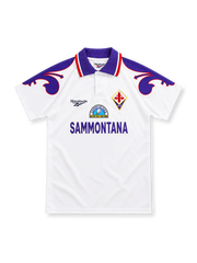Fiorentina 1995/96 white Reebok away jersey with a purple polo collar, red-and-white trim, oversized purple lily shoulder graphics, Fiorentina diamond crest and purple Sammontana sponsor lettering.