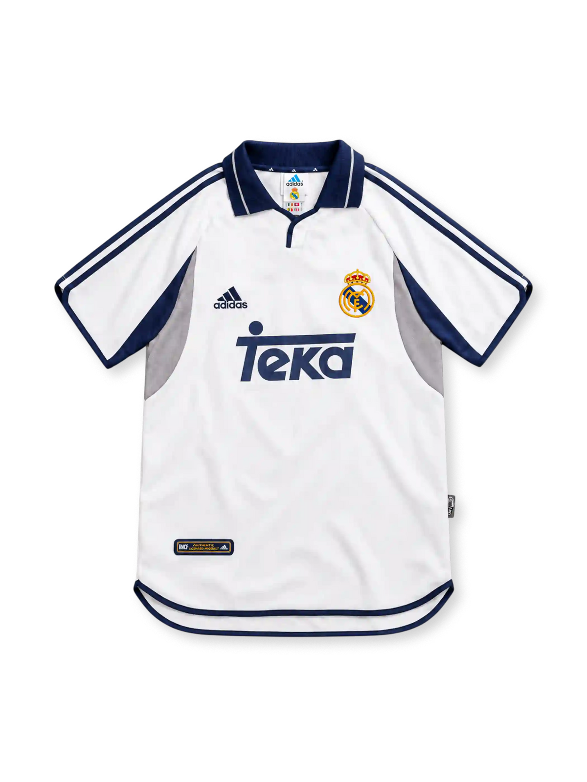 Real Madrid 2000/01 white adidas home jersey featuring navy polo collar, navy shoulder stripes, grey and navy curved side panels, crowned club crest, navy Teka sponsor and curved hem.