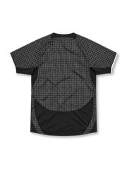 Manchester United 2003/05 Nike away jersey in black and charcoal grey with an all-over geometric pattern, white-trimmed collar and sleeve cuffs, white Nike Swoosh, Manchester United crest and Vodafone sponsor.