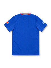 France 1996 royal-blue adidas home jersey with red-and-white shoulder stripes, white fold-down collar, braided tricolor lace-up neckline, white adidas wordmark, gold FFF rooster emblem, and heritage hem patch.