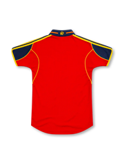 Spain 2000 red adidas home jersey featuring a navy-blue polo collar and shoulder panels, yellow three-stripe details, yellow piping, adidas logo, Spanish national crest, and Authentic Licensed Product hem label.