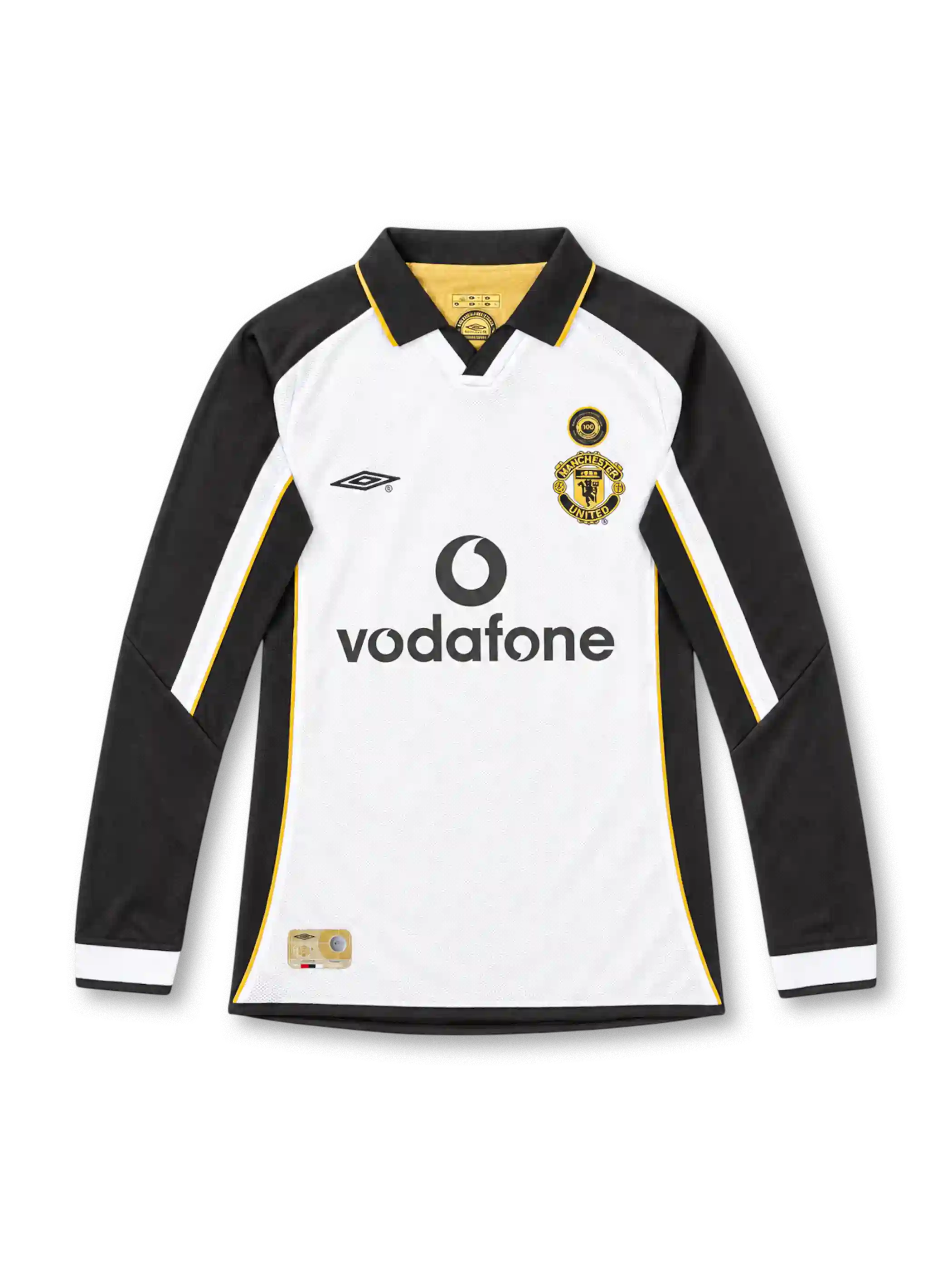 Manchester United 2001/02 centenary away long sleeve jersey by Umbro featuring a white body, black sleeves, gold piping, black polo collar, gold club crest, circular anniversary badge, Vodafone sponsor, and commemorative hem label.