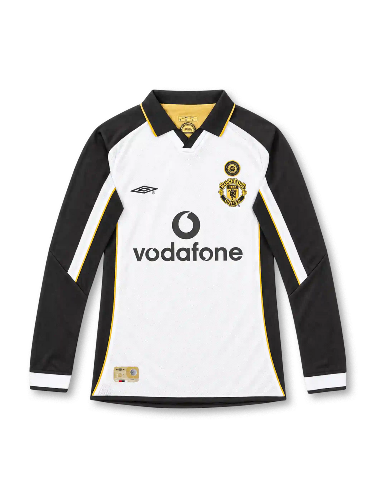 Manchester United 2001/02 centenary away long sleeve jersey by Umbro featuring a white body, black sleeves, gold piping, black polo collar, gold club crest, circular anniversary badge, Vodafone sponsor, and commemorative hem label.