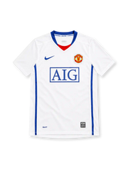 Manchester United 2008/09 Nike away jersey in white with blue V-neck trim, red neckline insert, royal-blue side panels, blue Nike Swoosh, Manchester United crest, boxed blue AIG sponsor, and NikeFIT hem detailing.