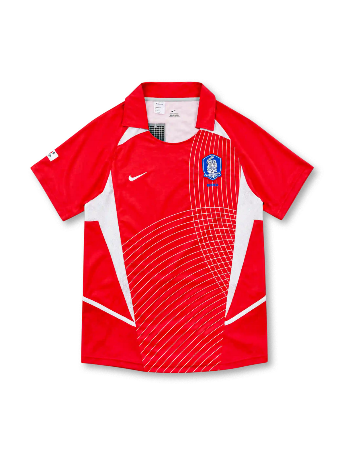 South Korea 2002 Nike home jersey in bright red with white geometric side panels, curved white line graphics across the front, red fold-down collar, white Nike Swoosh, and blue Korea Football Association crest.