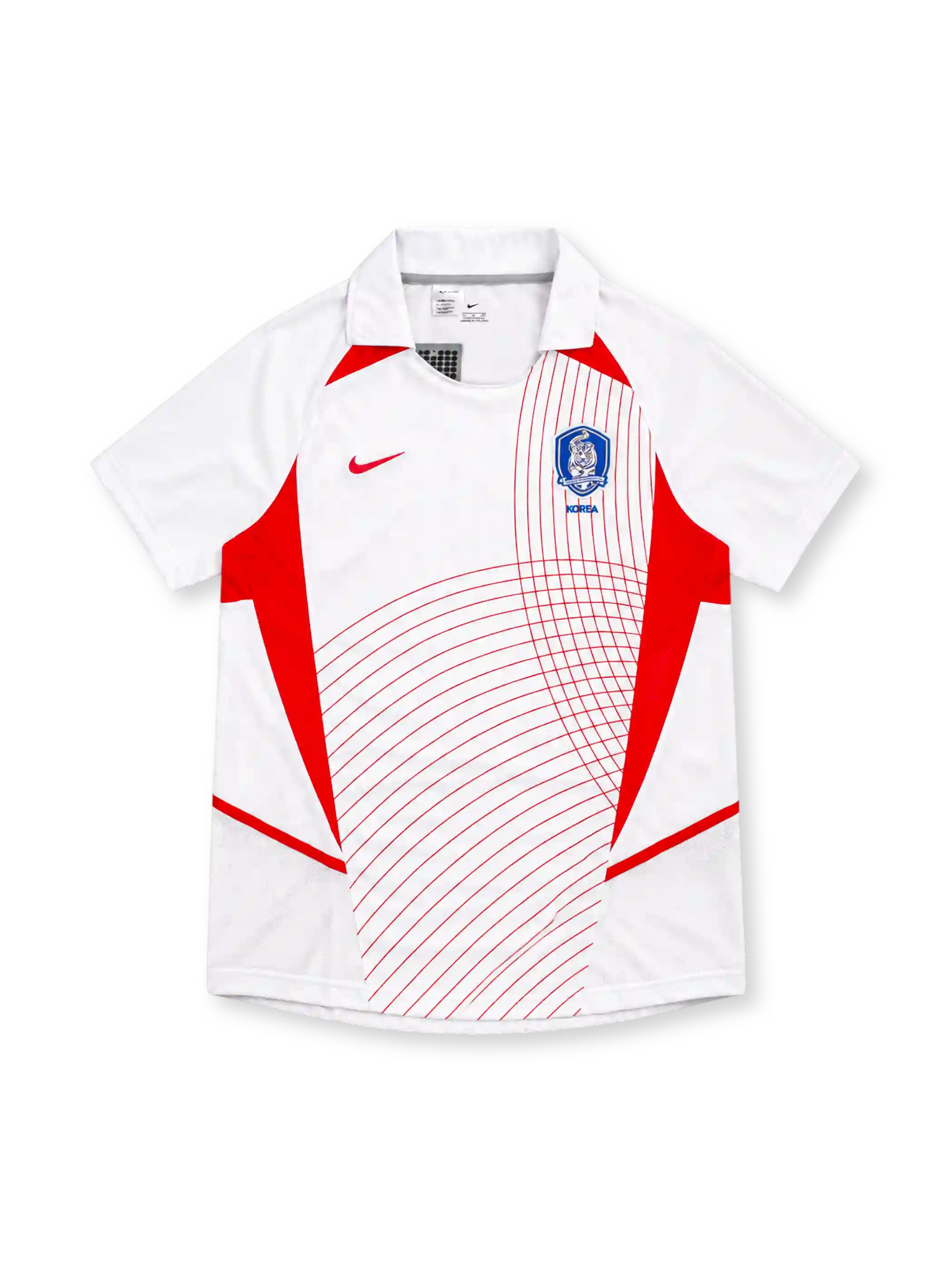 South Korea 2002 Nike away jersey in white with red geometric side panels, curved red pinstripe graphics, white fold-down collar, red Nike Swoosh, and blue Korea Football Association crest.