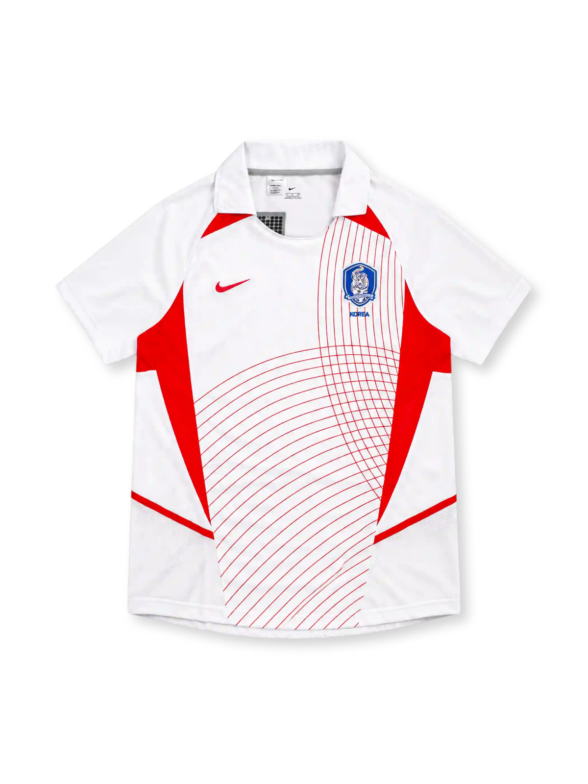 South Korea 2002 Nike away jersey in white with red geometric side panels, curved red pinstripe graphics, white fold-down collar, red Nike Swoosh, and blue Korea Football Association crest.