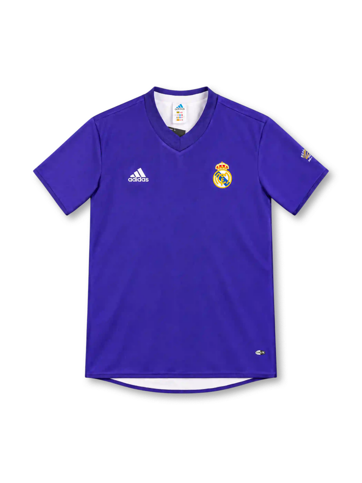 Real Madrid 2002/03 purple adidas third jersey with a solid purple body, tonal V-neck collar, white adidas logo, full-color Real Madrid crest, sleeve emblem, CLIMALITE branding, and a sponsorless front.